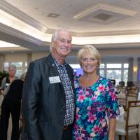 Chuck and Teri Losey, smiling and posing for the camera
